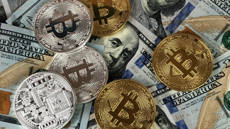 Close-up of bitcoins and US dollar bills symbolizing modern finance and cryptocurrency., tags: investors portfolios protect returns - pexel