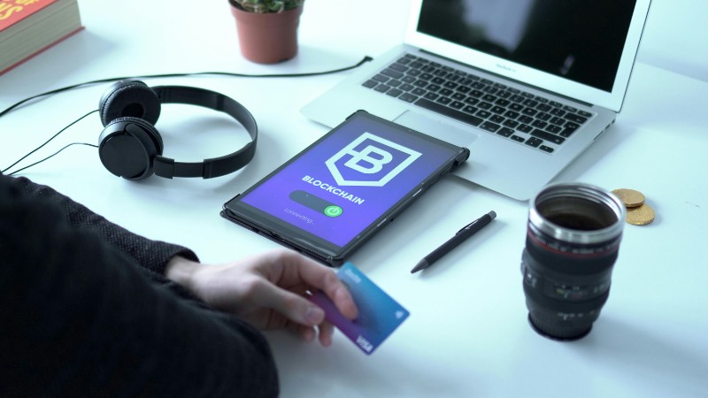 Modern workspace featuring blockchain technology. Laptop, tablet, and card on a desk., tags: innovation adoption global - pexel